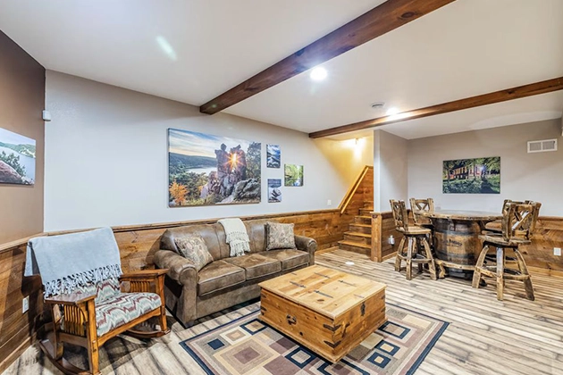 Forest cabin with front porch and firepit, representing Baraboo WI cabin rentals